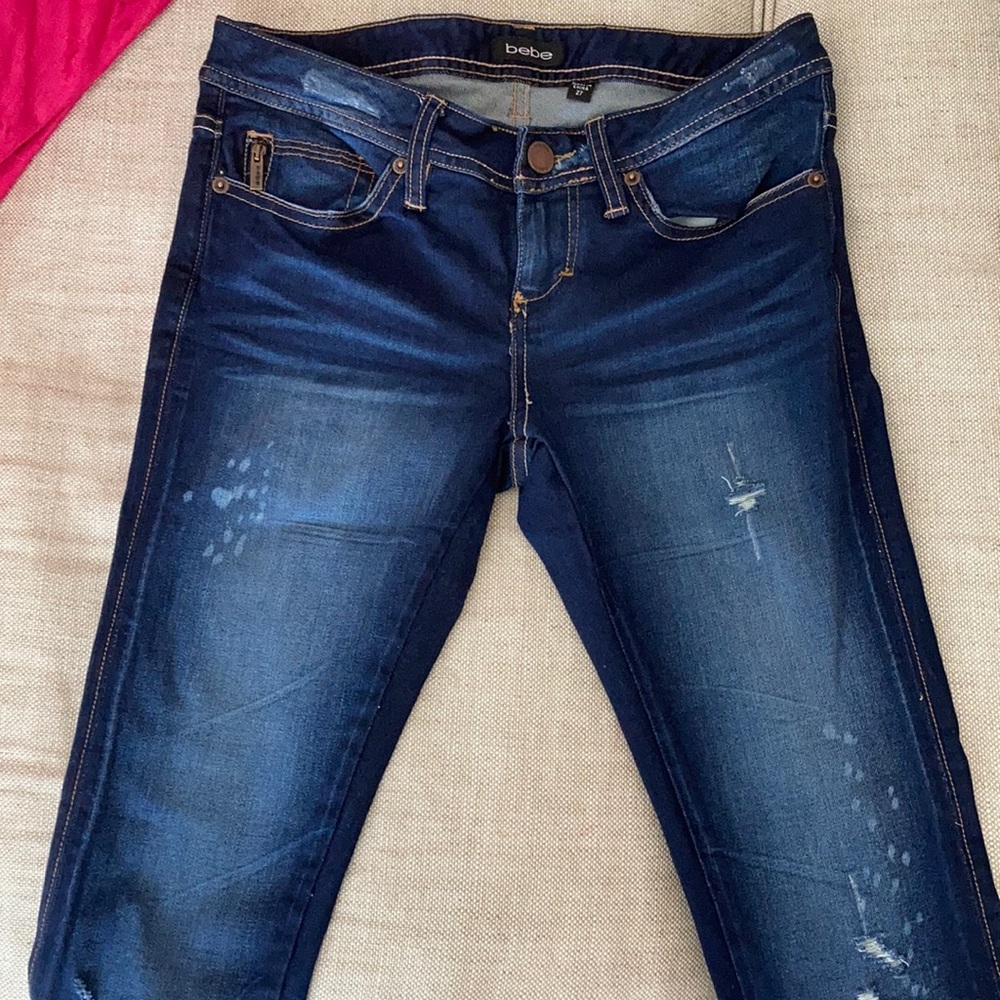 BEBE distressed skinny jeans